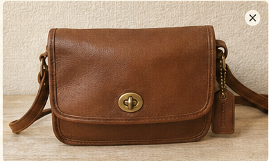 Vintage leather handbag photographed for thrift resale condition checks for Best titles and photos for vintage handbags sourced at Salvation Army stores
